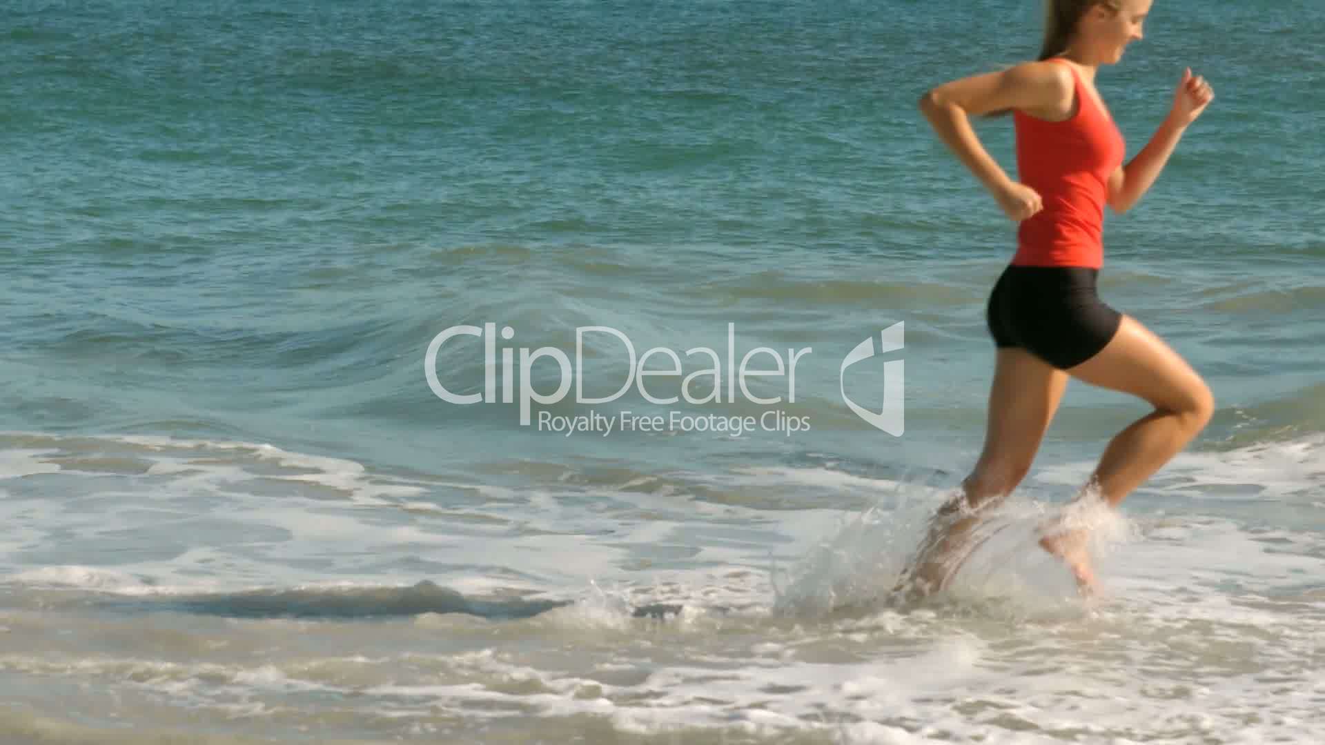 girl stepping into the waves girl stepping into the waves