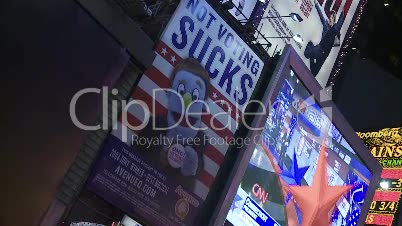 Crowd watching newsdisplay at Times Square