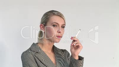 HD1080i Young blond business woman smoking a cigarette