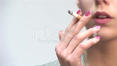 HD1080i Young blond business woman smoking a cigarette