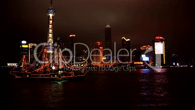 Brightly lit ship passing Shanghai, Pudong