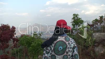 Malawi: man watching mountains