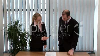 Business People Signing a Contract