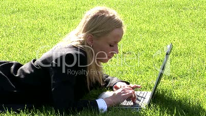 Woman on laptop outdoors 6