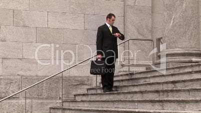 Man on Steps of Building
