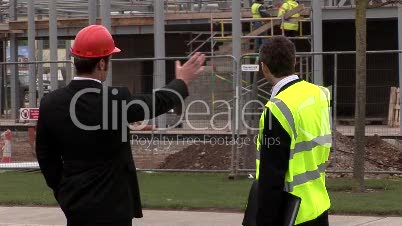 Two engineers in discussion at a Construction Site