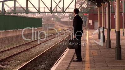 Man waiting at a train Station