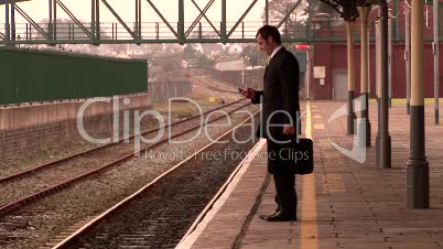 Man waiting at a train Station