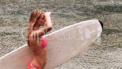 Woman Holding a Surfboard
