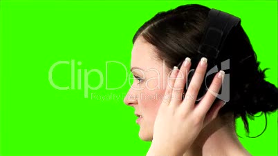 Green screen of a woman listening to music