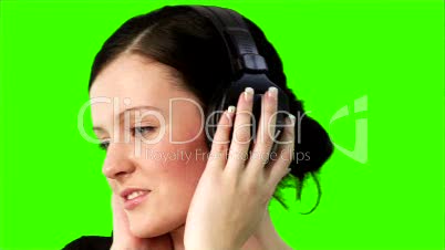 Green screen of a woman listening to music