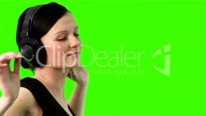 Green screen of a woman listening to music