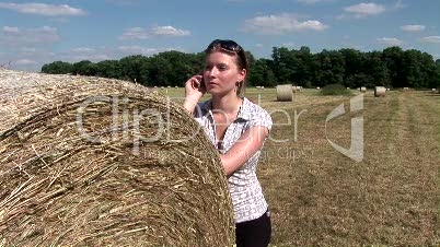 HD1080i Young woman talking on the phone outdoors in nature.