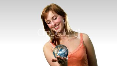 Atractive lady holding the earth