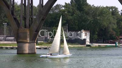 sailing boat floats on the river.