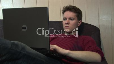 HD1080i Young man working with laptop indoor