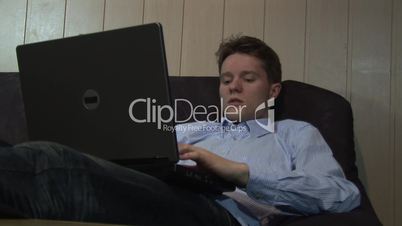 Hd1080i Young man working with laptop indoor