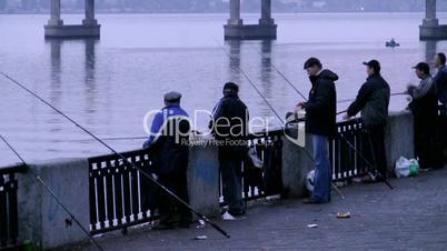 Group of fishermen on quay of Dnepr