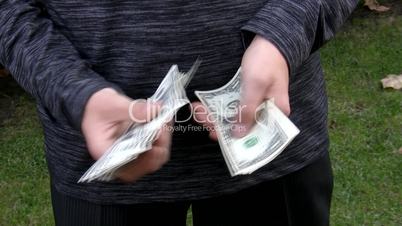 businessman's hands counting dollars.