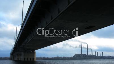 time lapse of cloudy sky and automobile bridge.