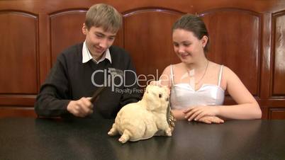 brother and sister break a coin box with coins.