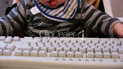Baby typing on computer keyboard 1