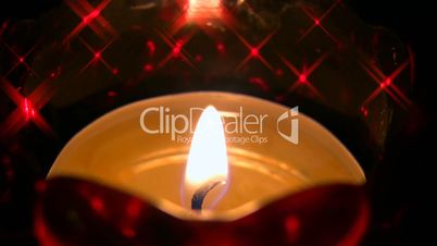 Candle in the dark with shining stars in the background HD