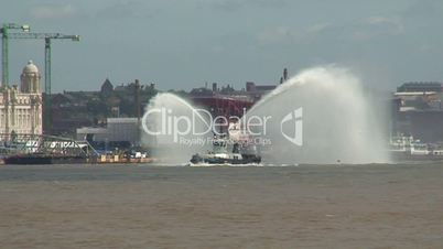 Fire tug spraying water 1