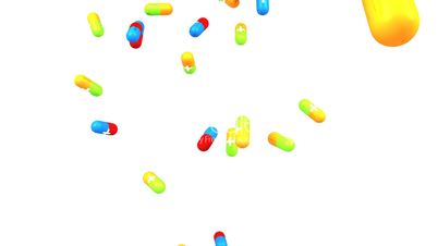 Colorful pills falling in slow motion