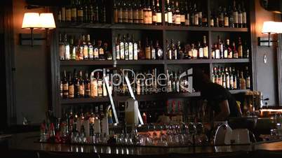 Barman cleans wine bar