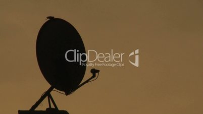 silhouetted satellite dish