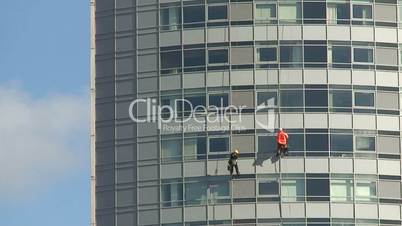 Cleaning windows on a high rise building