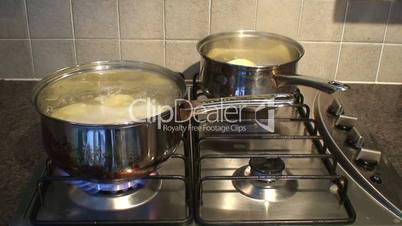 Cooking dinner on a stainless steel gas hob