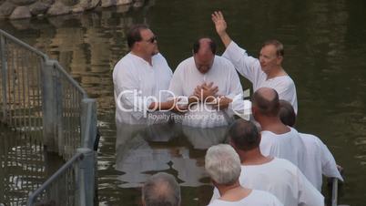 Baptism of pilgrims in the Jordan River Holy Land Israel HD