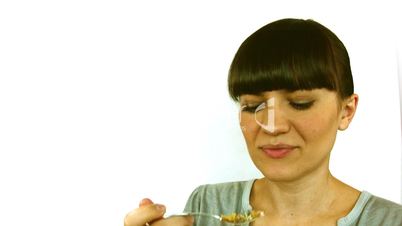 young beautiful woman eating cereal