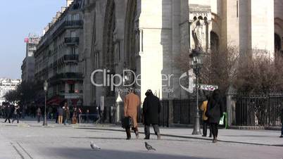 People walking in front of Notre Dame, Paris.