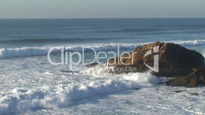 Sea waves against rocks in the beach