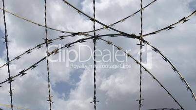 Time lapse of barbed wire against sky