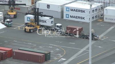 Containers being unloaded from trucks