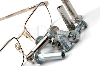 Still-life of glasses with coupling bolts.