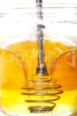 Honig im Glas mit Portionierer
