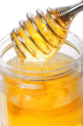 Honig im Glas mit Portionierer