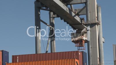 Cranes moving containers at the port