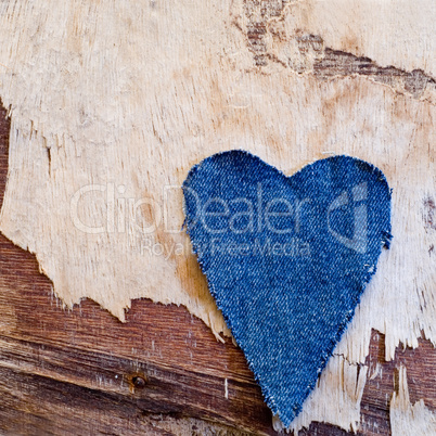 jeans heart on driftwood plank