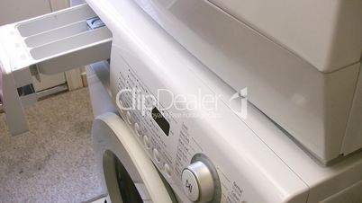 Filling the washing machine reservoir with liquid soap