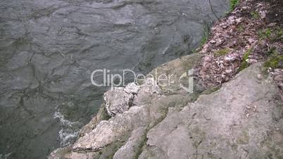 Rocky edge with flowing river below