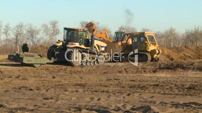 HD-2008-10-9-14 cat dozer and tractors working field
