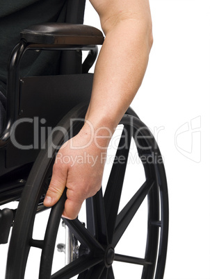 Hand on wheel chair