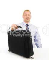 Business man setting down briefcase