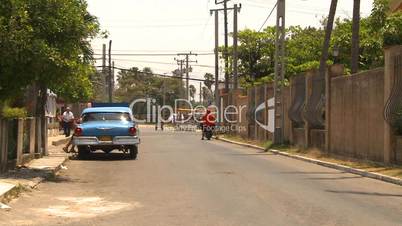 Cuba old car repair street and announc